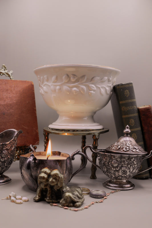 White Ceramic Pedestal Bowl With Wreath Detailing and Gold Details